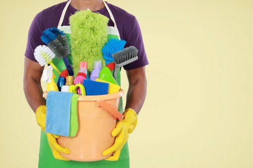 Cleaning staff carrying out safe workplace procedures